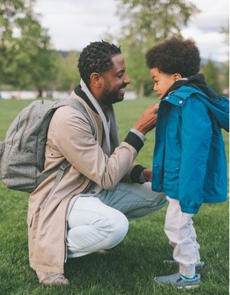 Parent and child in a park
