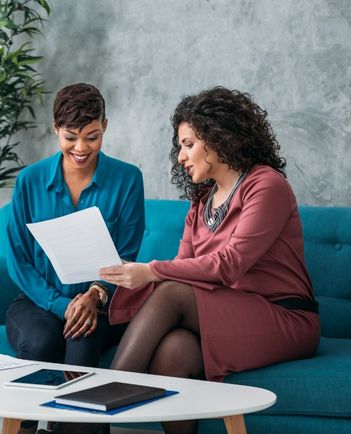 Financial advisors discussing documents